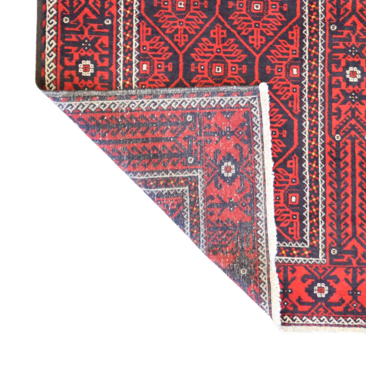 4'10" x 7'0" BLACK AND RED BALUCH SEMIANTIQUE PERSIAN RUG