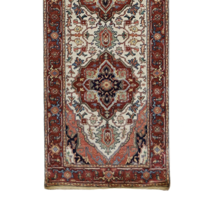 2'7" x 18'0" BEIGE AND RUST SERAPI GEOMETRIC INDIAN RUG