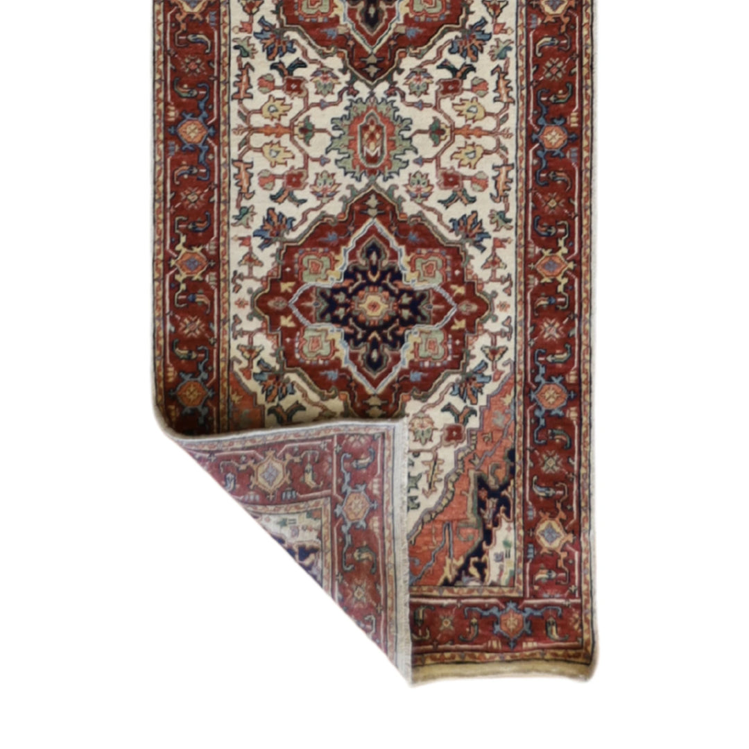2'7" x 18'0" BEIGE AND RUST SERAPI GEOMETRIC INDIAN RUG